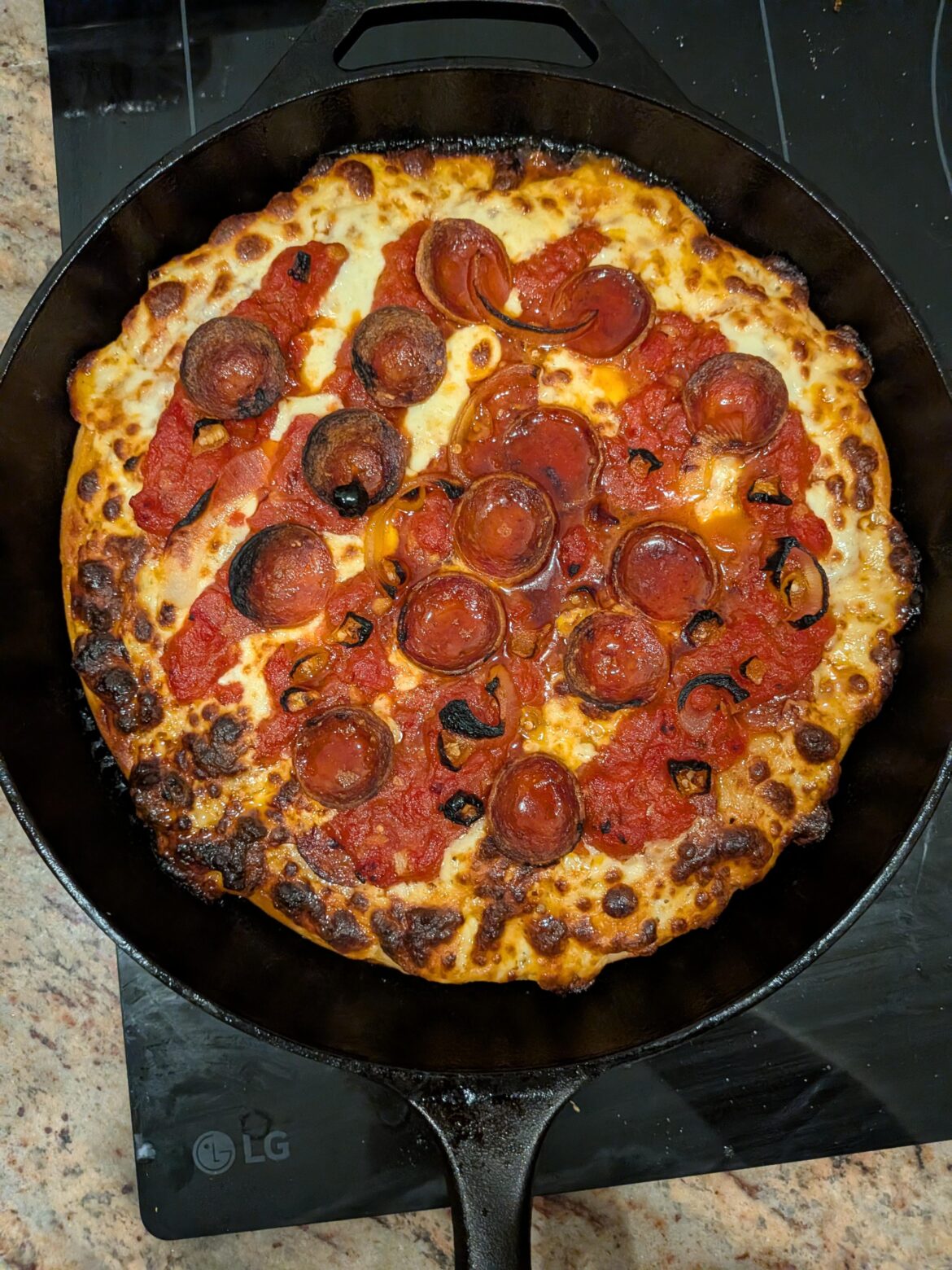 First attempt at a cast iron pizza. A little messy but very tasty.