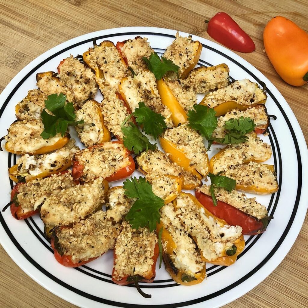 Easy Cheesy Vegan Pepper Poppers 🌶️ Sweet mini bell peppers filled with plant-based cheese & seasonings topped with toasty breadcrumbs