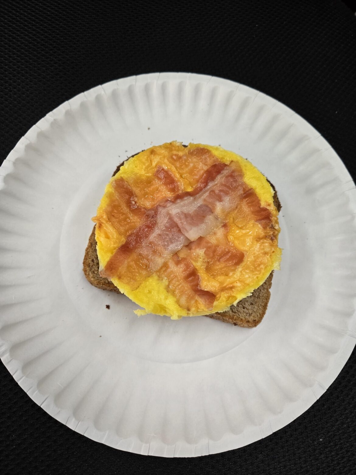 Quail eggs and mayo, mixed up, with cheese and bacon on top