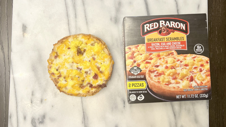 Red Baron Breakfast Scrambles breakfast pizza with Canadian ham on serving tray.