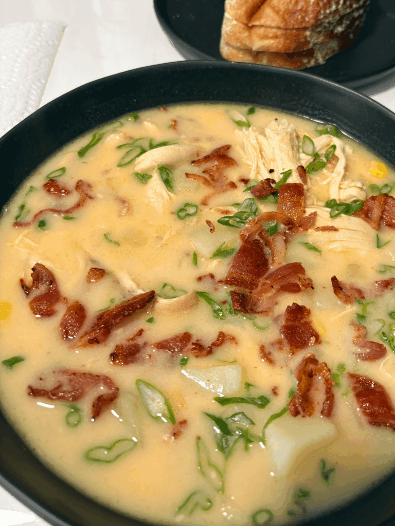 Chicken potato and cheddar soup with crispy bacon and fresh green onion