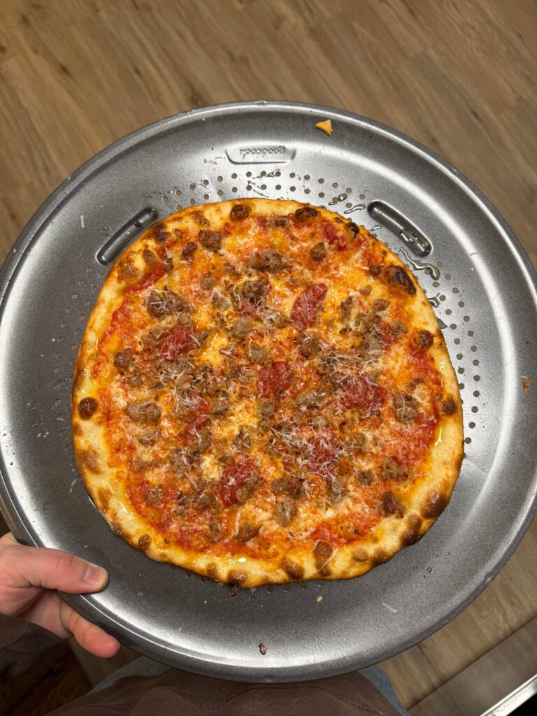 Sausage with some sauce on top