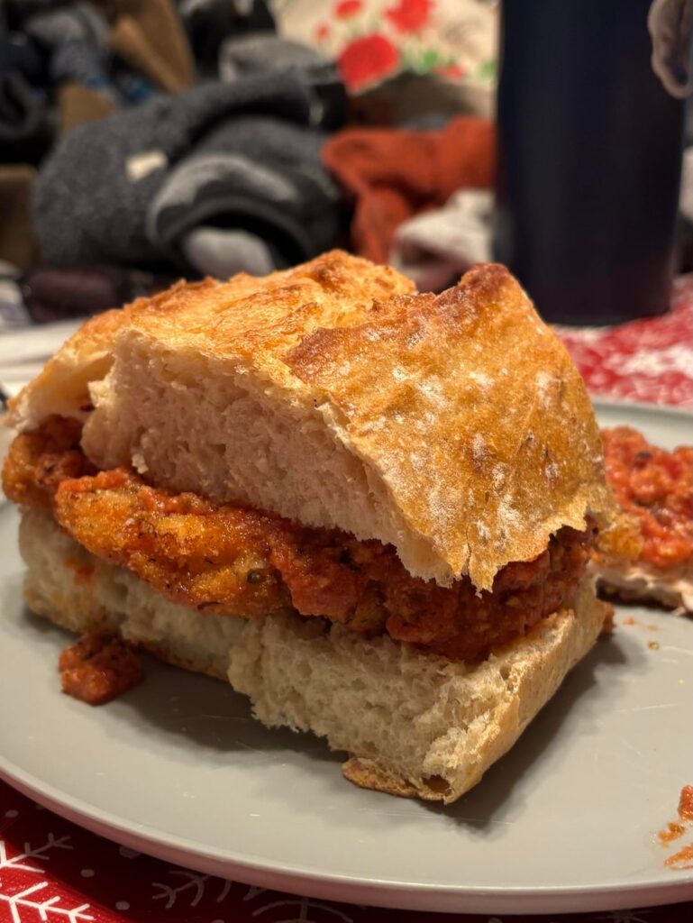 My son impressed his family. Chicken Parm w/ homemade crusty loaf, fresh mozzarella, and sauce for days.