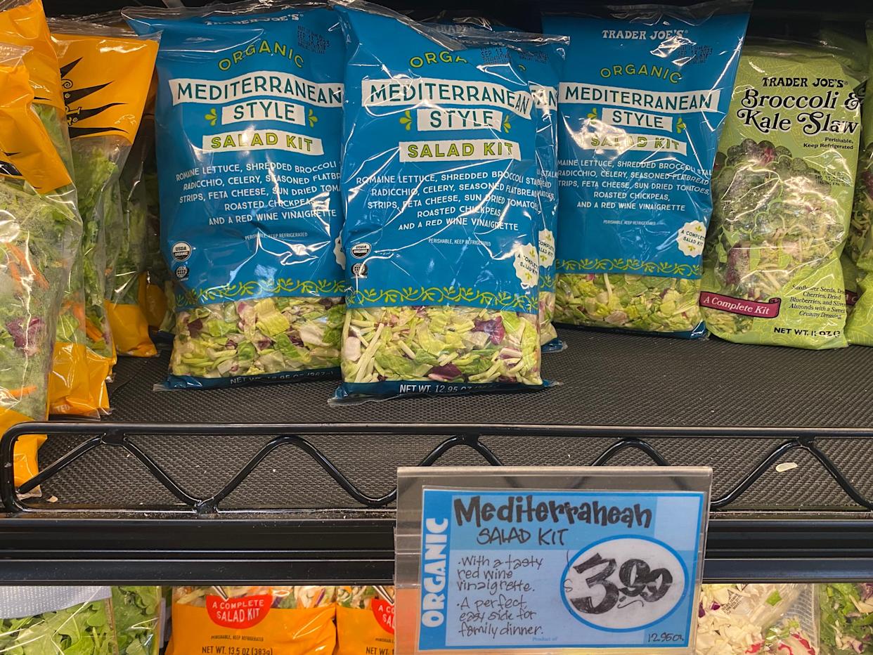 mediterranean style salad kit on the fridge shelf with salad kits at trader joes