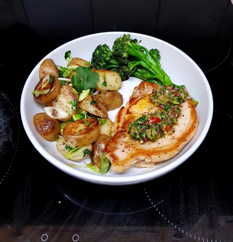 Pork Loin Steaks Steaks with Chimichurri, Fried New Potatoes Tossed in Herbs and Tenderstem Brocolli.