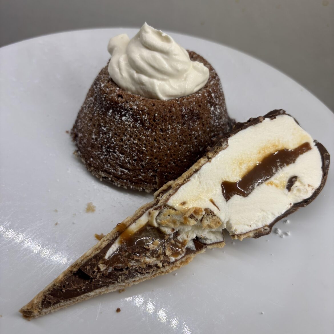 Chocolate Lava Cake with homemade whipped & a drumstick on the half shell