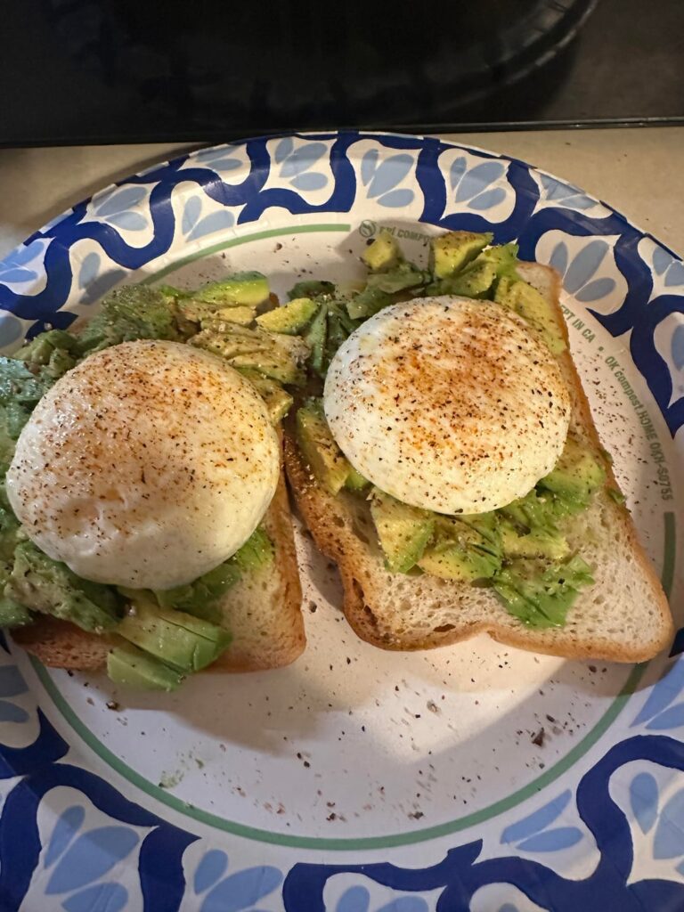 Poached eggs on avocado toast with a sprinkle of slap ya mama