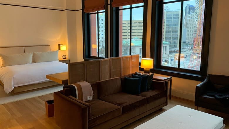 A guest room in the Shinola Hotel with a bed and a sitting area