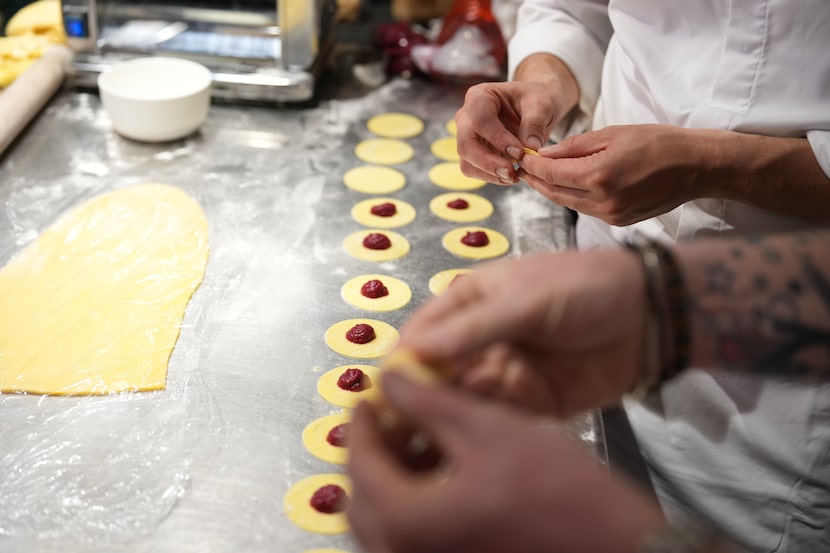 Local chef Gianluca Belli demonstrates how to make Casunziei, a type of ravioli that is...