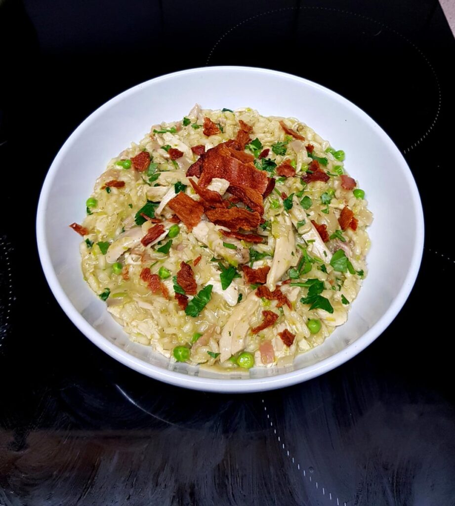 (Leftover Sunday Roast) Chicken, Crispy Smoked Bacon and Pea Risotto. Finished With Parsley and Lemon Juice.