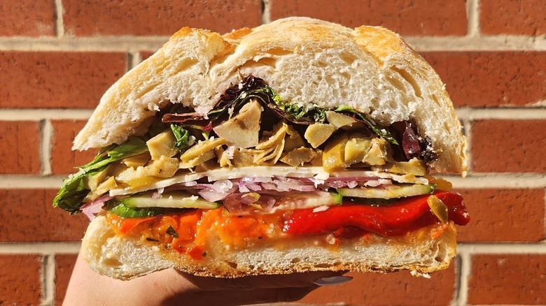 A person holding a sandwich from DiPasquale's in Baltimore