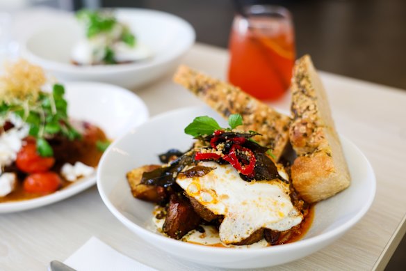 Mixed herbed potato with eggs and garlic labne.