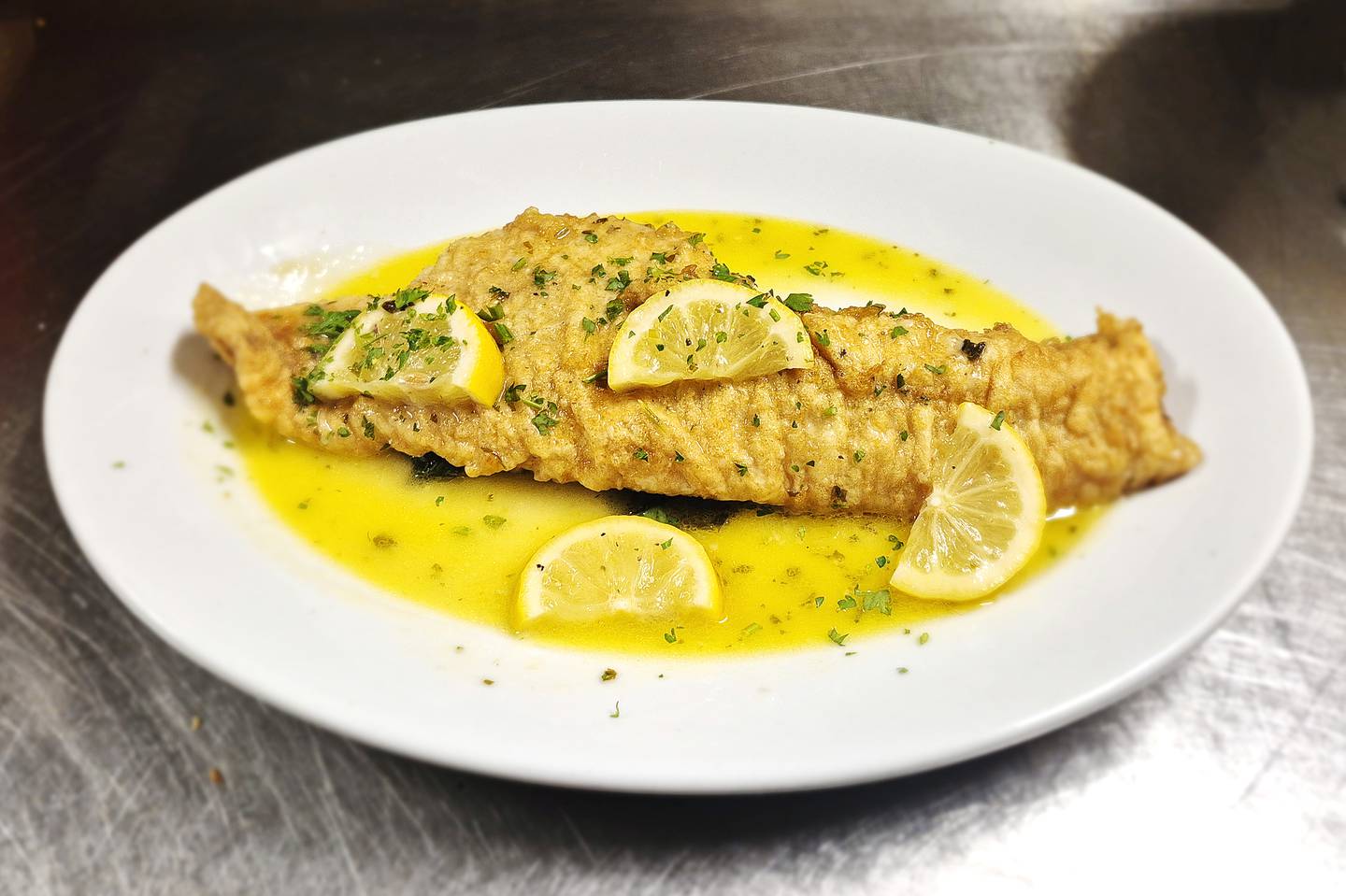 Reoccurring menu specials at Basil Tree Ristorante in Dixon include Mediterranean seabass franchese (pictured), Arancini, Short rib polenta and a Calabrese style filet mignon.