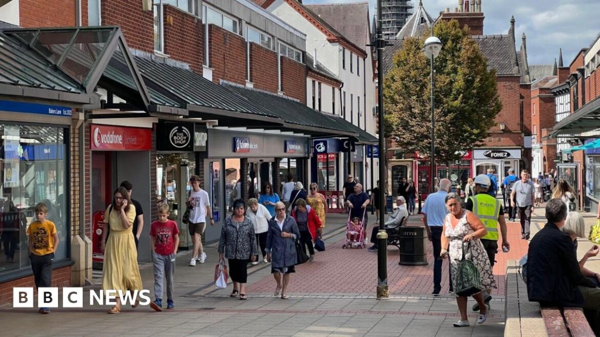 How Lichfield has grown into a thriving destination for foodies A busy town centre with people walking along a pedestrian street. There is a canopy on both sides above shop fronts.