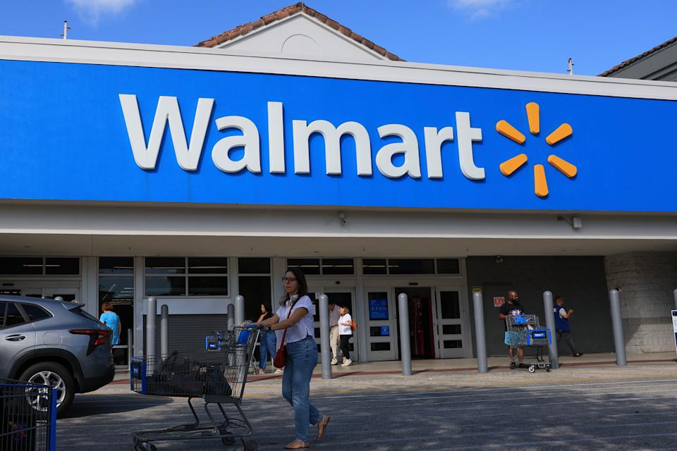 HOLLYWOOD, FLORIDA - NOVEMBER 20:  A Walmart sign hangs on the exterior of the store on November 20, 2025 in Hollywood, Florida. The retailer reported earnings per share of 62 cents and revenues of $179.5 billion through its latest quarter, sending the stock up more than 5.6% to above $106 shortly after trading opened.  (Photo by Joe Raedle/Getty Images)