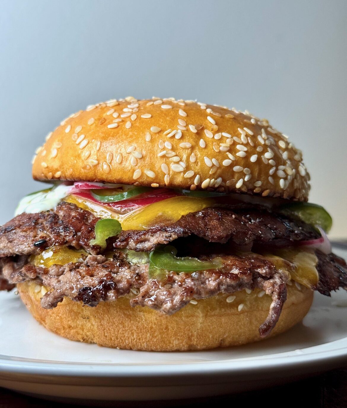 Double smash with smoked cheddar, pickled red onions and jalapeňos, cilantro/lime crema.