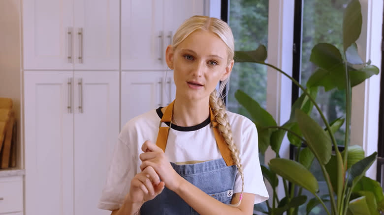 Social media chef Tini Younger wearing an apron