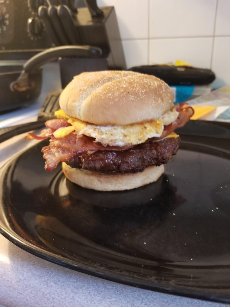 Bacon, farmer sausage, egg cheeseburger