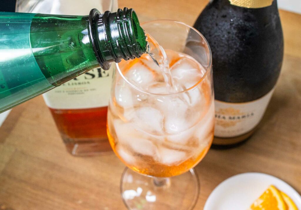 Adding Sparkling Water to a Portuguese Spritz