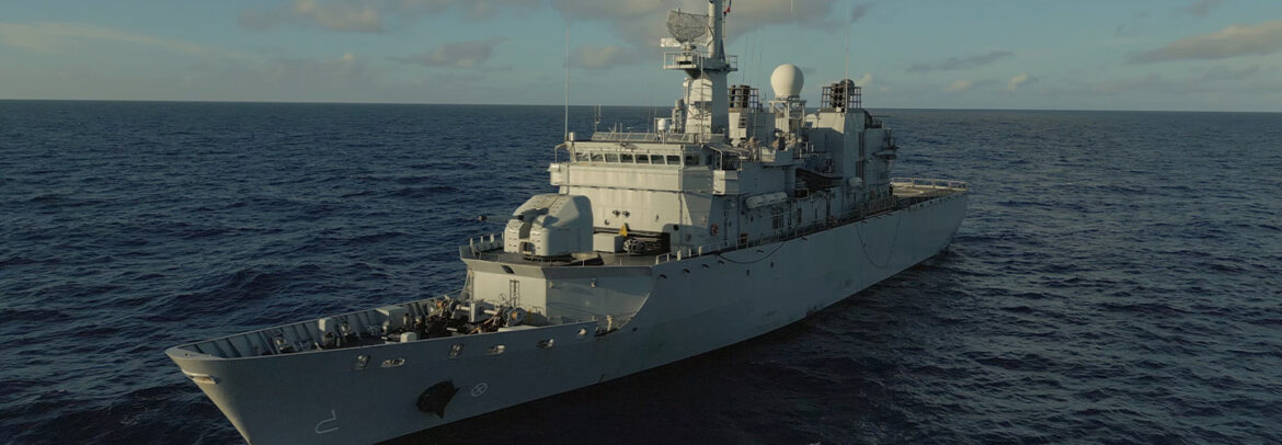 A sea rescue coxswain aboard a French warship