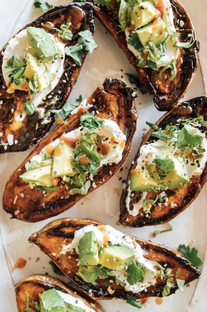 crispy roasted sweet potatoes with yogurt, herbs, and everything spice