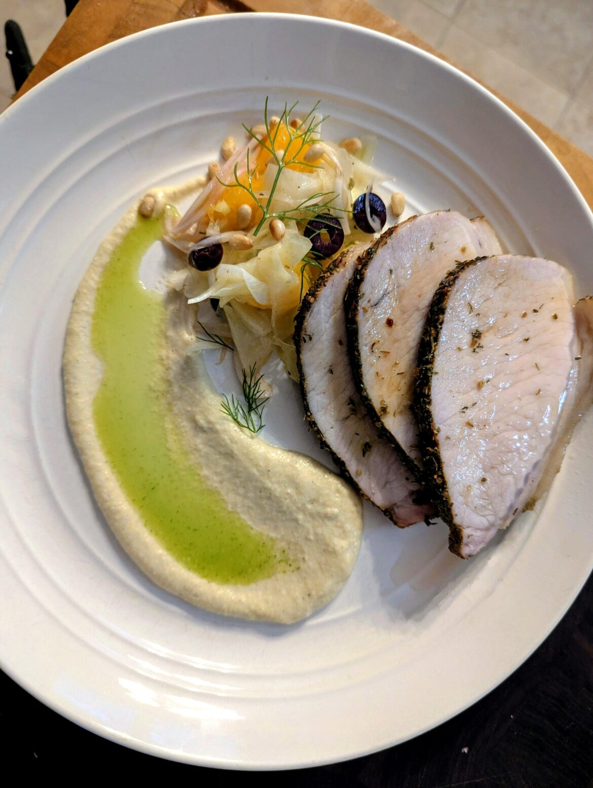 Porchetta, fennel, orange salad & black olive salad, fennel & apple puree, herb oil.