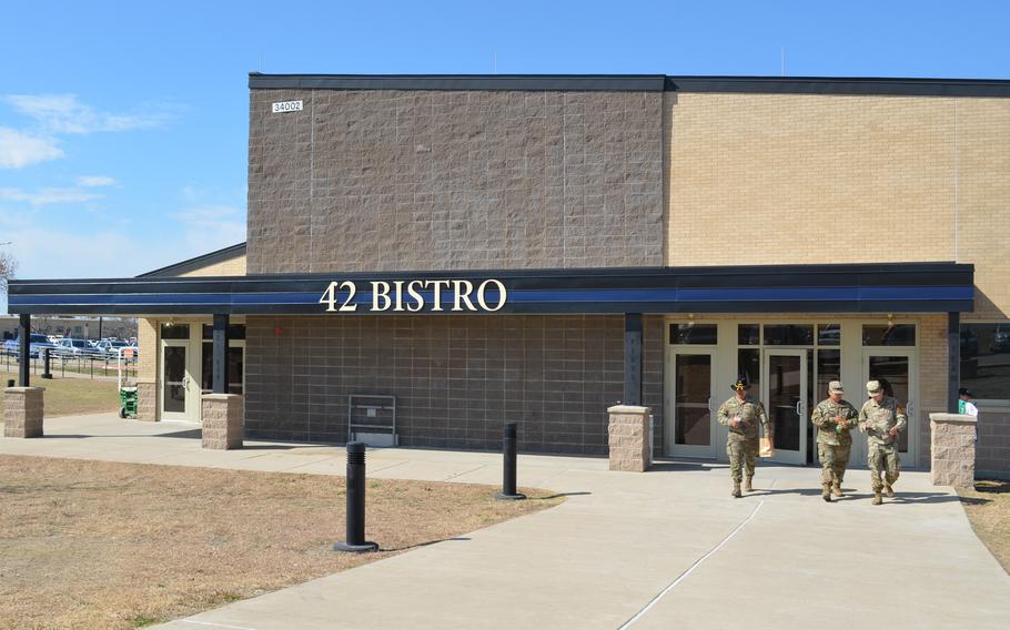 Soldiers walk away from the new dining facility.