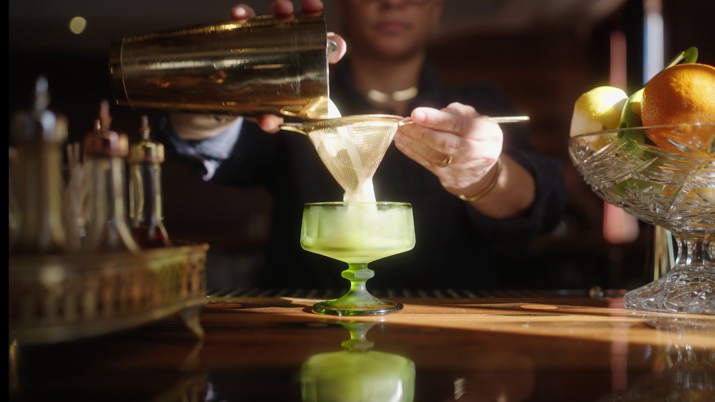 Beverage director Jade Ayala prepares a drink at The Port of Call, a restaurant in Mystic, Connecticut.