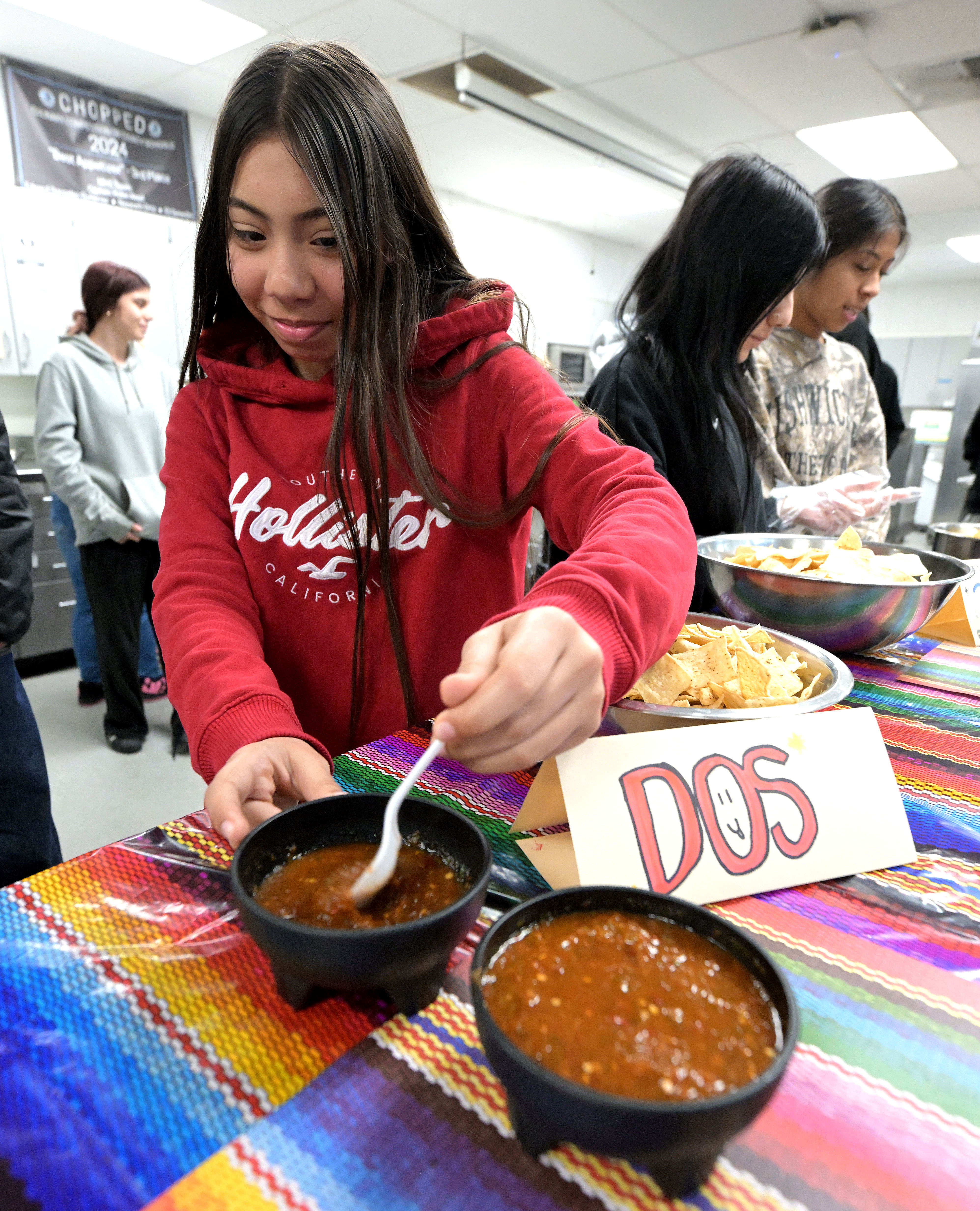 Montclair High School freshman Jaslin Ramos, 15, prepares salsa for...