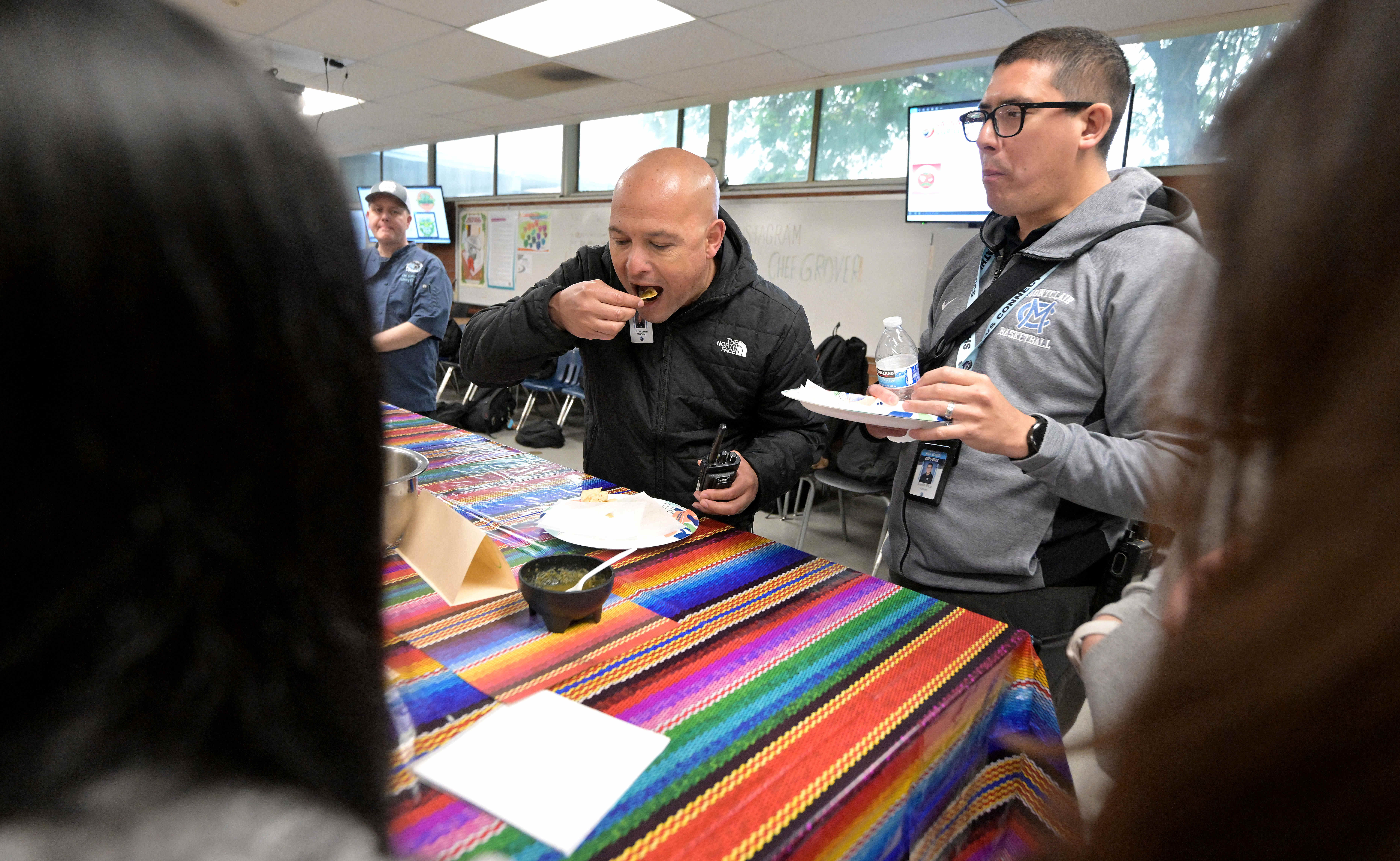 Montclair High School Principal Lino Gomez, center, and Assistant Principal...