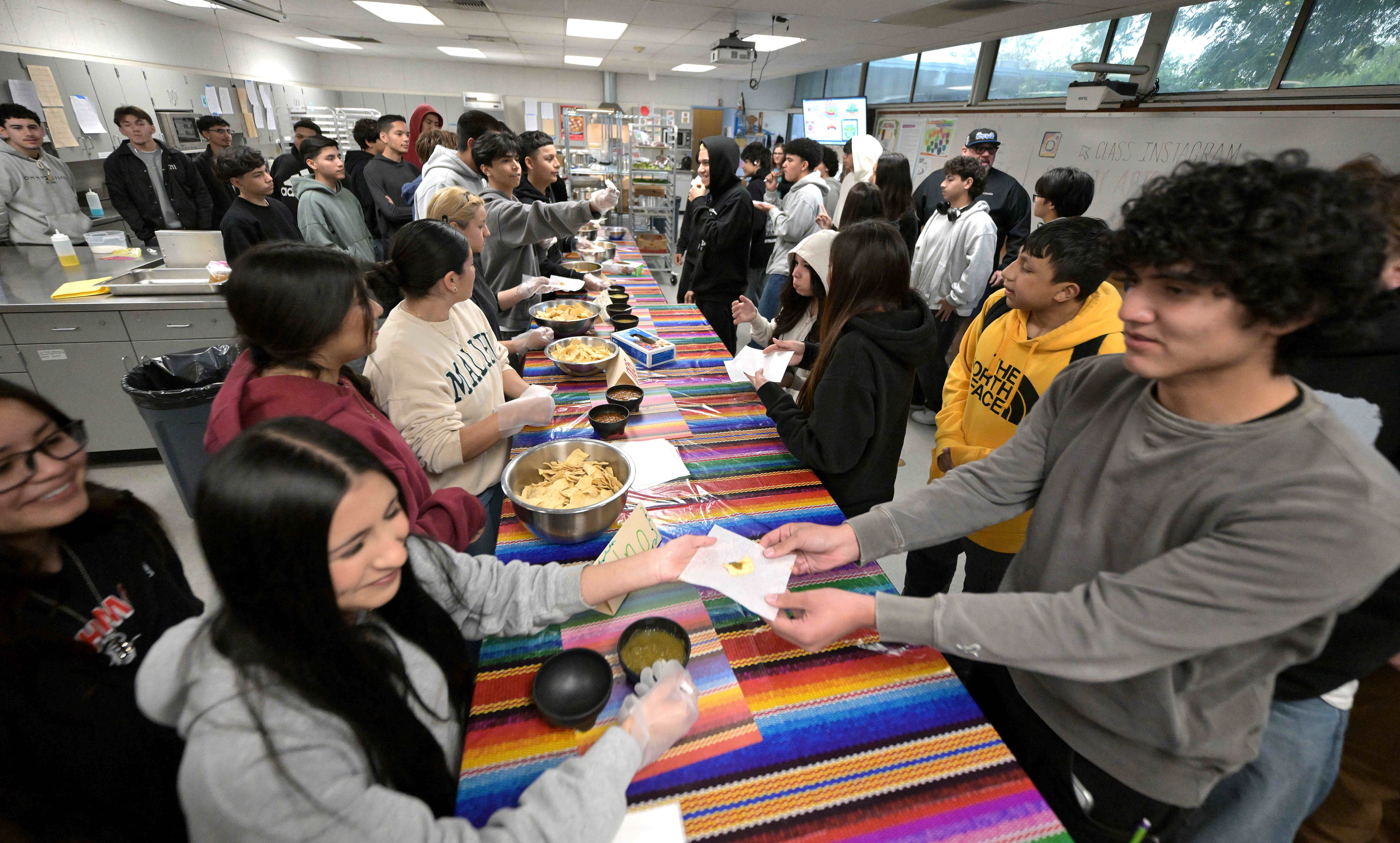 Montclair High School culinary arts students share samples of salsa...