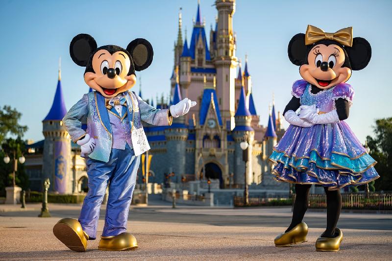 Mickey & Minnie Mouse at Disney World (via Disney)