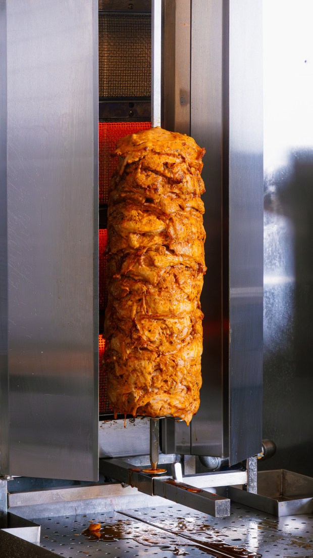 Lamb and beef Doner Kebab is freshly grilled during dinner service. (Meze & Kebab photo by Emre Cakir)