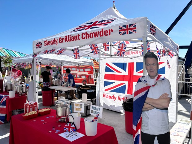 The Bloody Brilliant Chowder stand had a British theme, featuring cardboard cutouts of British icons including chef Gordon Ramsay and King Charles III. (Caroline Hemphill Santa Cruz Sentinel)