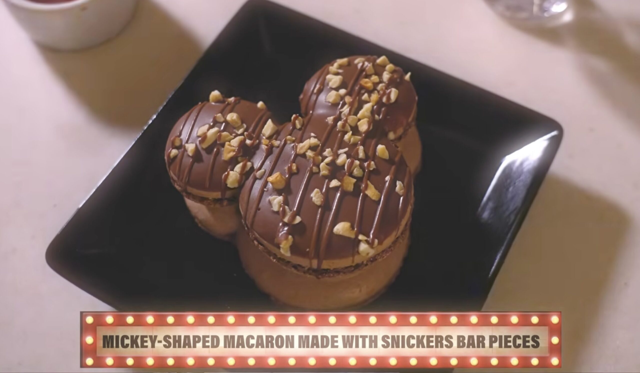 Mickey-Shaped Macaron with Snickers Bar Pieces – Uncork California