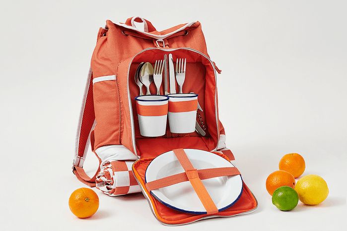 orange backpack with oranges and limes