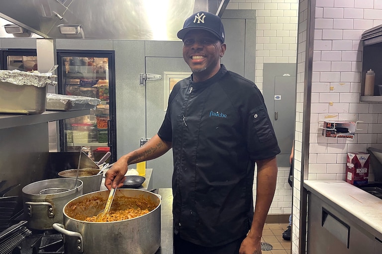 Chef JR, of Fraiche in D.C. puts the final touches on his signature black-eyed peas recipe, handed down from his grandmother. The dish is prepared over the course of four days.