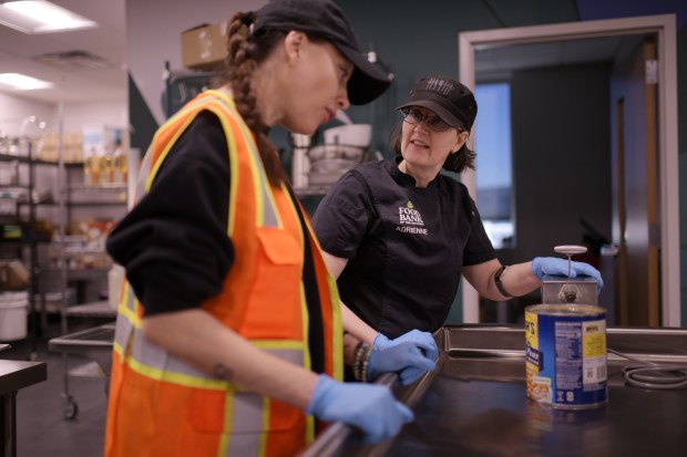 Sous chef Adrienne Flowers, right, talks to Intern Daria Mirgorodskaia at Food Bank of the Rockies in Aurora on Wednesday, Feb. 4, 2026. (Photo by Hyoung Chang/The Denver Post)