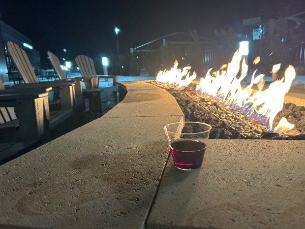 A glass of wine left behind sits on the patio of Mayfield Heights Aquatic and Community Center. (Frank Mecham- The News-Herald)