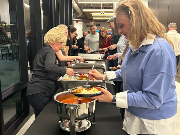 People line up for their taste of Italian food during the Mayfield Heights taste of Italy event. (Frank Mecham- The News-Herald)