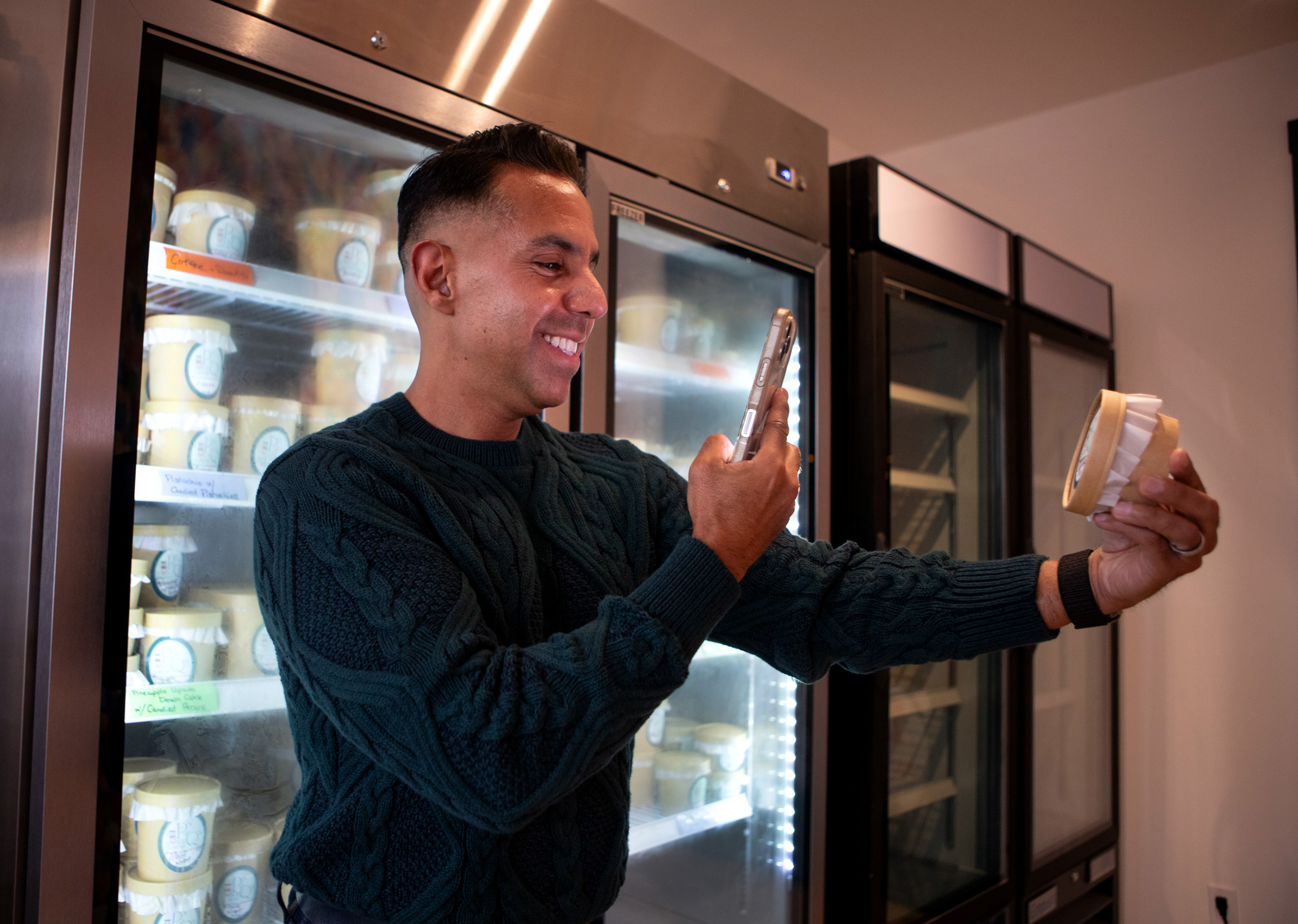 Customer, Omar Stanley Posadas of Napa, photographs a container of...