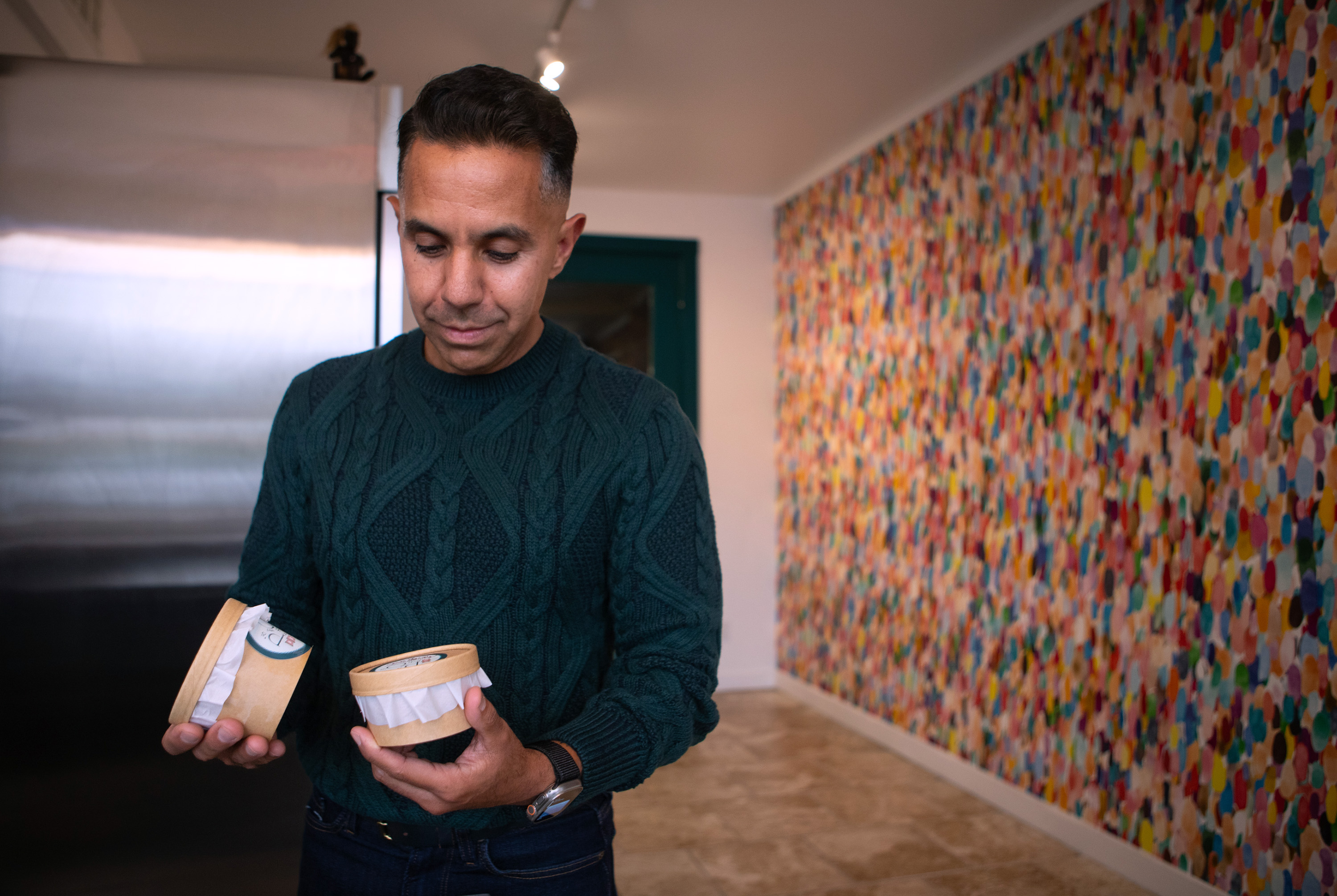 Customer, Omar Stanley Posadas of Napa, looks at ice cream...