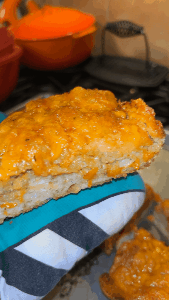 I overproofed my sourdough so I made cheddar pizza bread