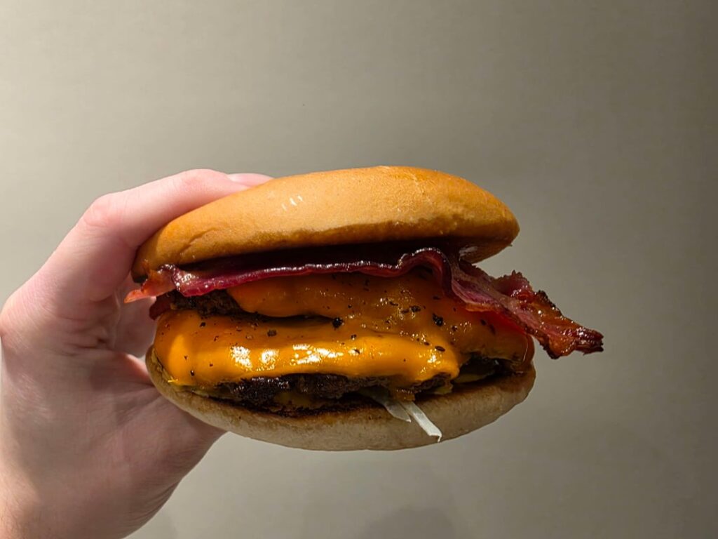 Double smash burger with smoked bacon and cheddar