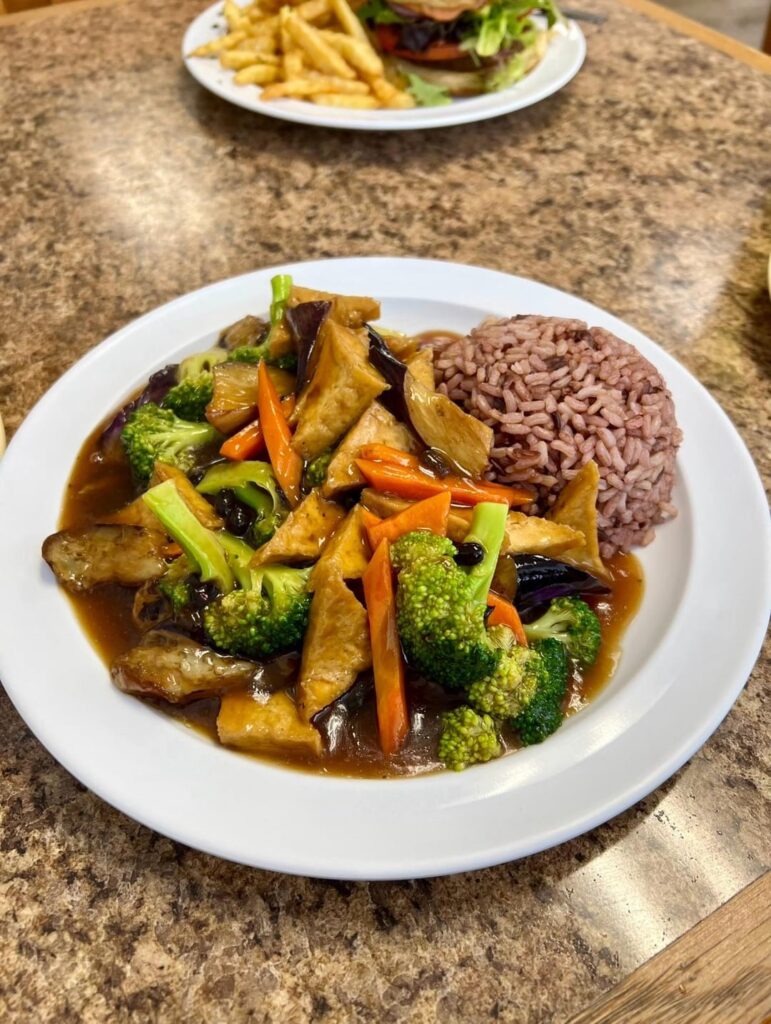 Entrees and desserts for a lunch date at a vegan restaurant