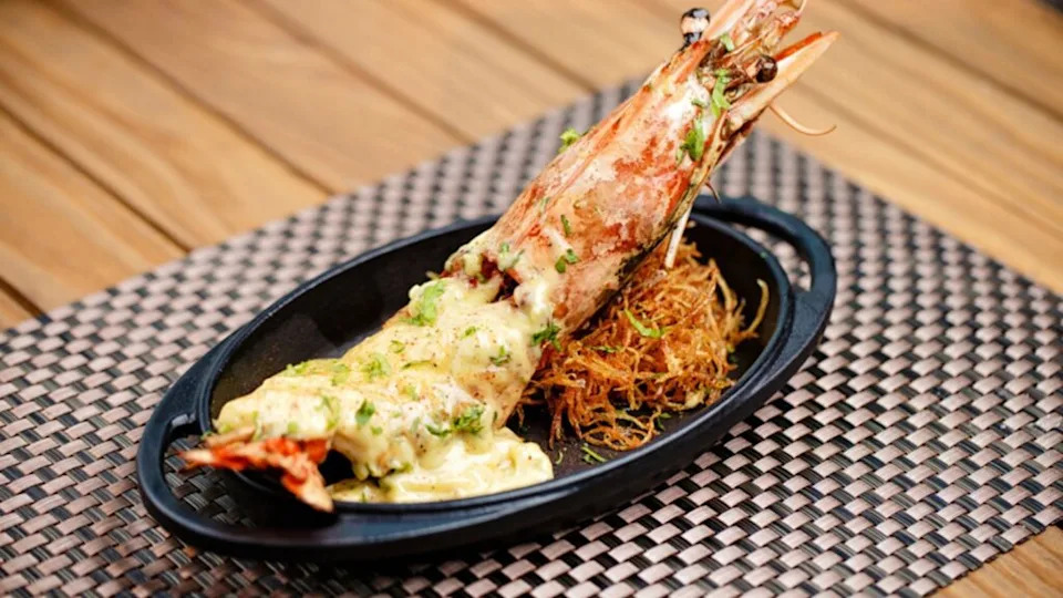 Lobster thermidor seafood baked lobster with cheese on a table