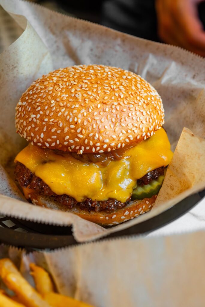 "The classic" and "DH" burgers with cheese fries at Amboy