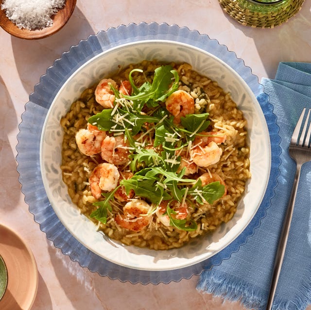Shrimp risotto served with lemon and cheese.