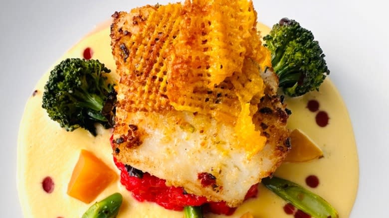 A plate of pistachio-encrusted sea bass at Giovanni's Ristorante in Detroit