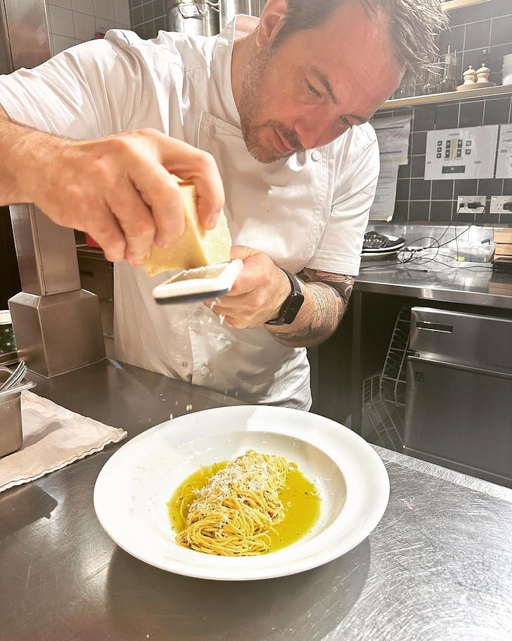 Shaun prepares a pasta dish.